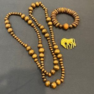 Wooden 40’ necklace with matching bracelet. Gold Zebra pendant.